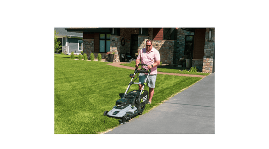 Man edging the lawn with the push lawn mower and the Trimyxs attached