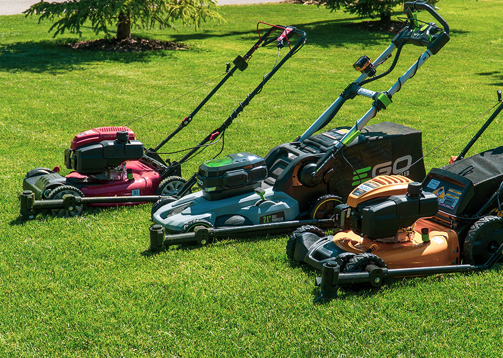 three different brands of push lawn mowers with the Trimyxs attached