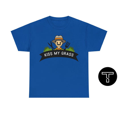 A blue t-shirt with phrase "kiss my grass" and an image of a man holding a two lawn care tools