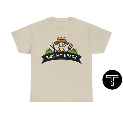 A sand t-shirt with phrase "kiss my grass" and an image of a man holding a two lawn care tools